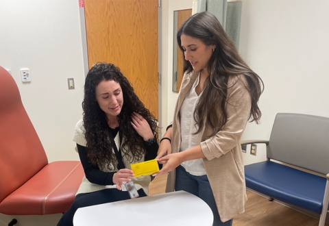 Image of Sylvia Lombardo in an office with another person.