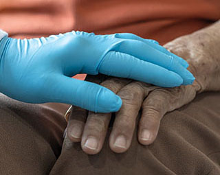 Parkinson's disease patient, Arthritis hand and knee pain or mental health care concept with geriatric doctor consulting examining elderly senior aged adult in medical exam clinic or hospital