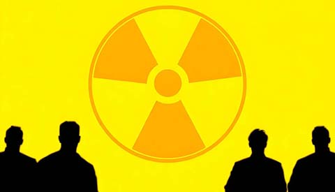 nuclear symbol illuminated against a bright yellow background with silhouettes of people