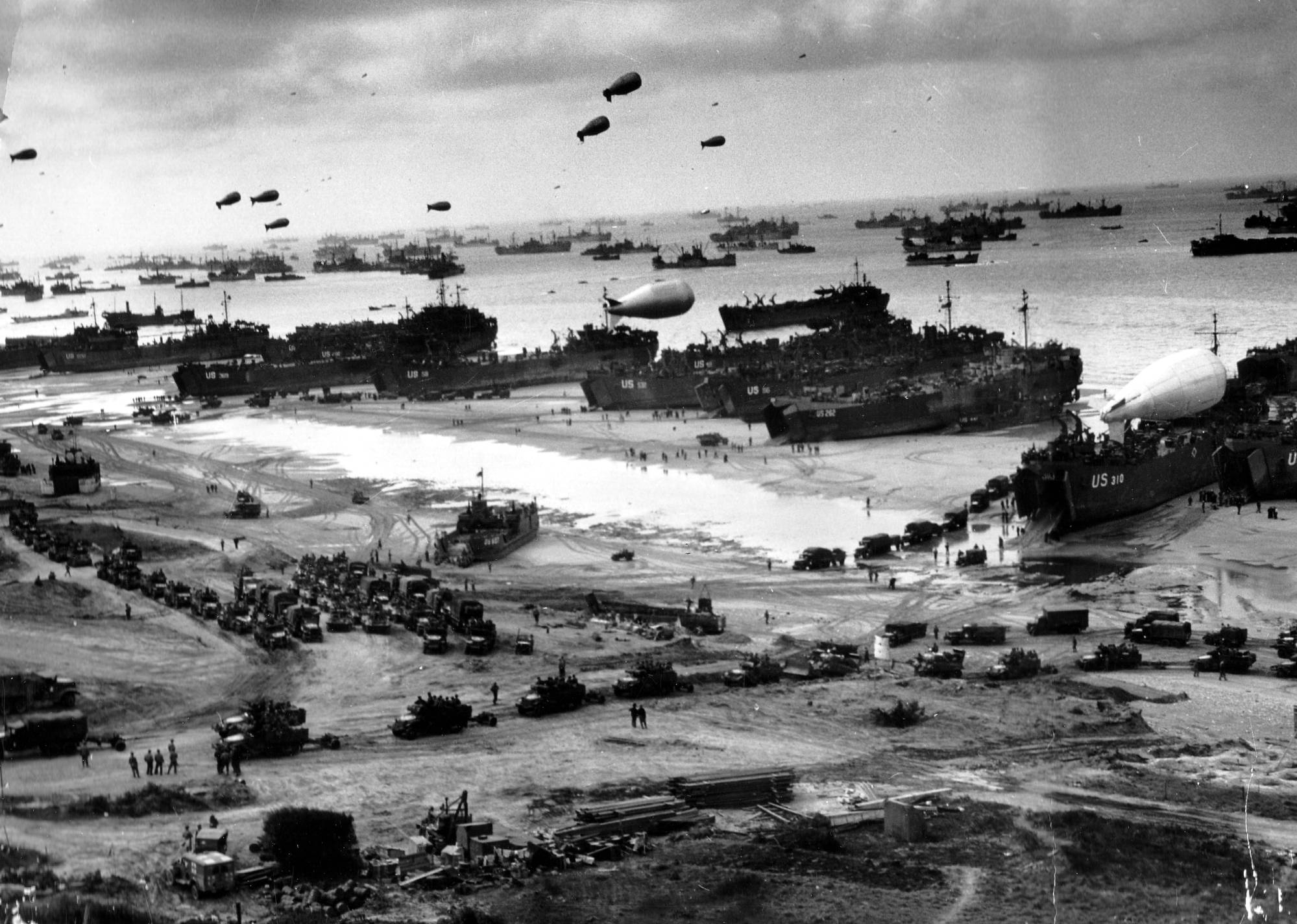 Black and white photo of amphibious landing craft on Omaha Beach, June 6, 1944.