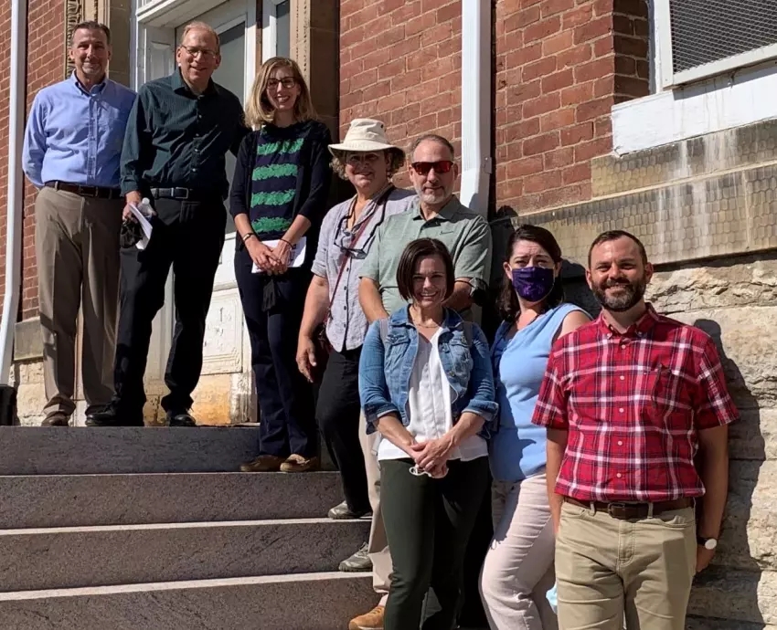 Core Project Team in front of building 129, August 2021, from left: Mike Visconage, Jeffrey Seiken, Katie Delacenserie, Sara Amy Leach, Kurt Senn, Amy Ackman (intern), Robyn Rodgers and Richard Hulver. (VA Photo)