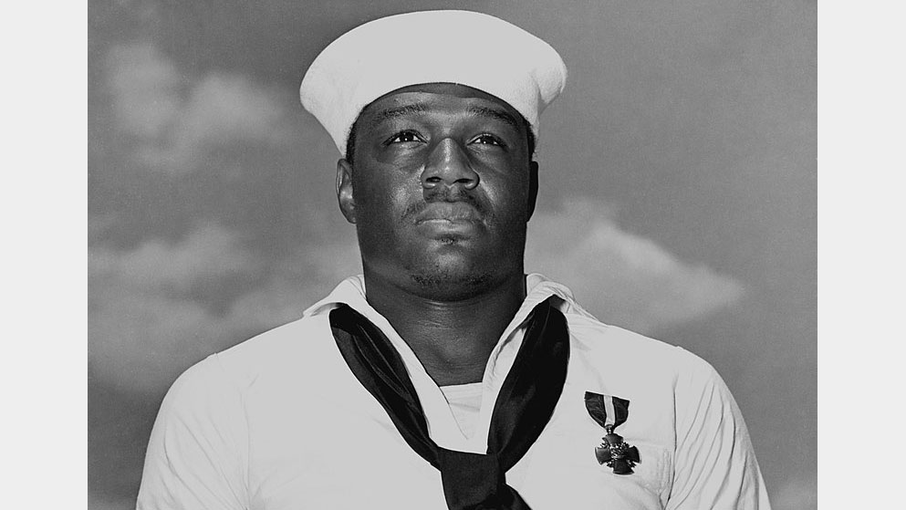 Doris Miller while serving in the U.S. Navy, wearing his Navy Cross awarded for his actions on board the USS West Virginia (BB-48) during the attack at Pearl Harbor. (National Archives)