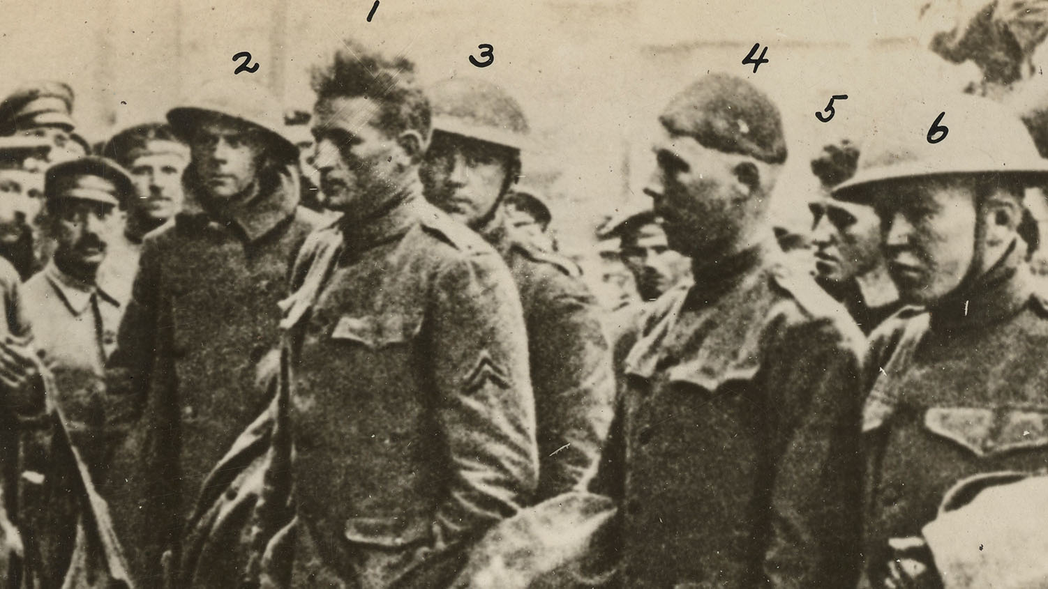 Pvt. Clyde Grimsley & Sgt. Halyburton with four other U.S. soldiers, photographed after capture in 1917, prior to transport to German prison camps. (National Archives & Records Administration)