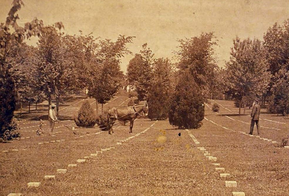 Plot of unknown gravesites in Corinth National Cemetery, Mississippi, circa 1892. This is one of the earliest photos of such a section. Note the slight variance in height above ground of the 6x6 markers. (National Archives)