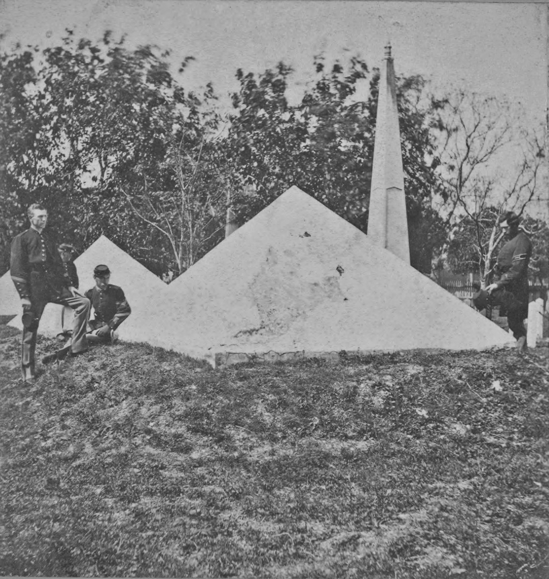 Soldiers pose beside the pyramids and obelisk, c. 1885. The burial grounds containing the memorial at the U.S. Army post in St. Augustine were designated a national cemetery in 1881. (New York Public Library)