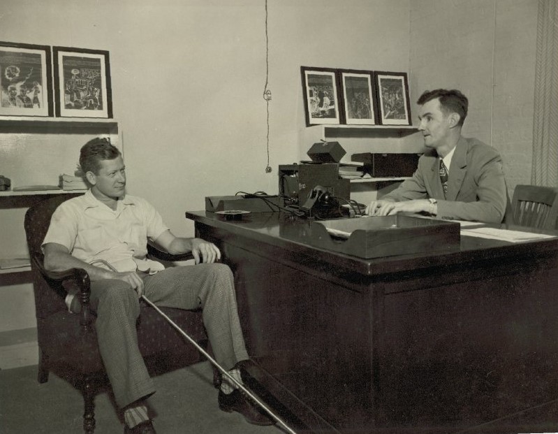 Russell C. Williams, right, a blinded Veteran and first chief of VA’s Central Blind Rehabilitation Center, photographed in his office with Naron A. Ferguson, left, the center’s first trainee, in 1948. (Museum of the American Printing House for the Blind)