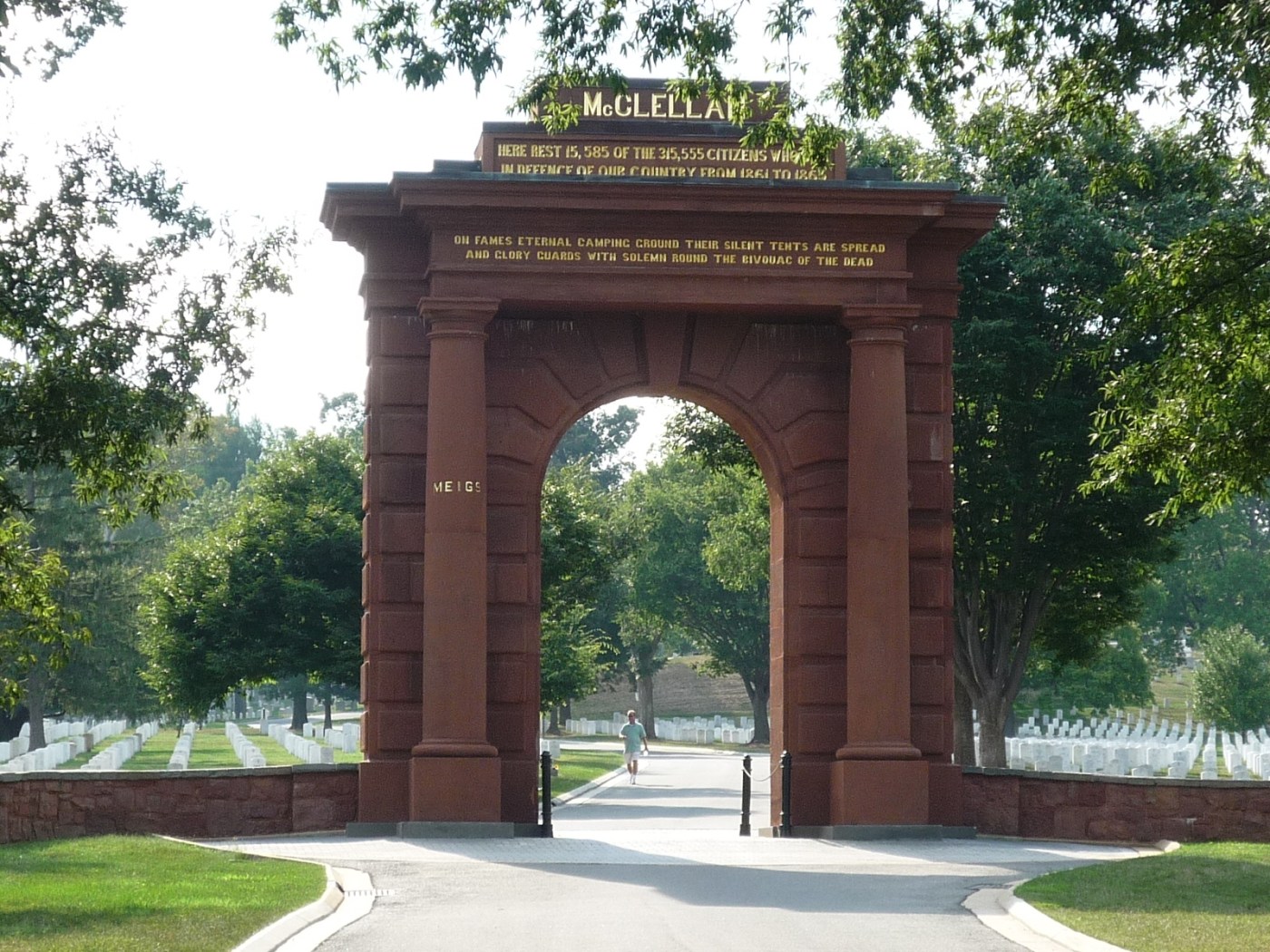 East-facing side of the McClellan Archway at the original entrance to Arlington National Cemetery, with lines from the poem displayed in gold on the pediment. The pediment on the other side features a different verse. (hmdb.org)