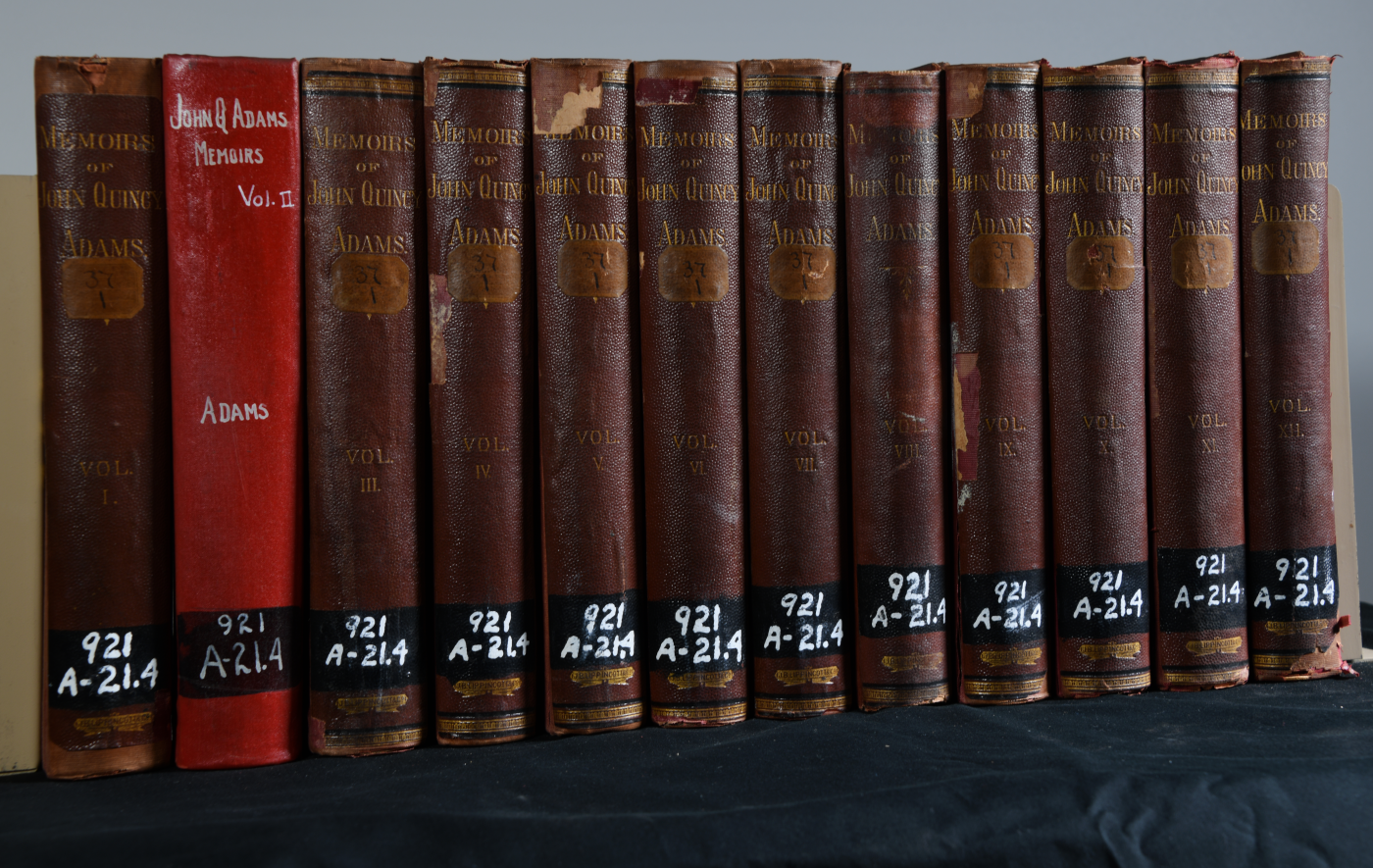 The 12-volume series of the memoirs of John Q. Adams, as they appear in our archival collection. These books too show evidence of repair, perhaps by Helen herself.
