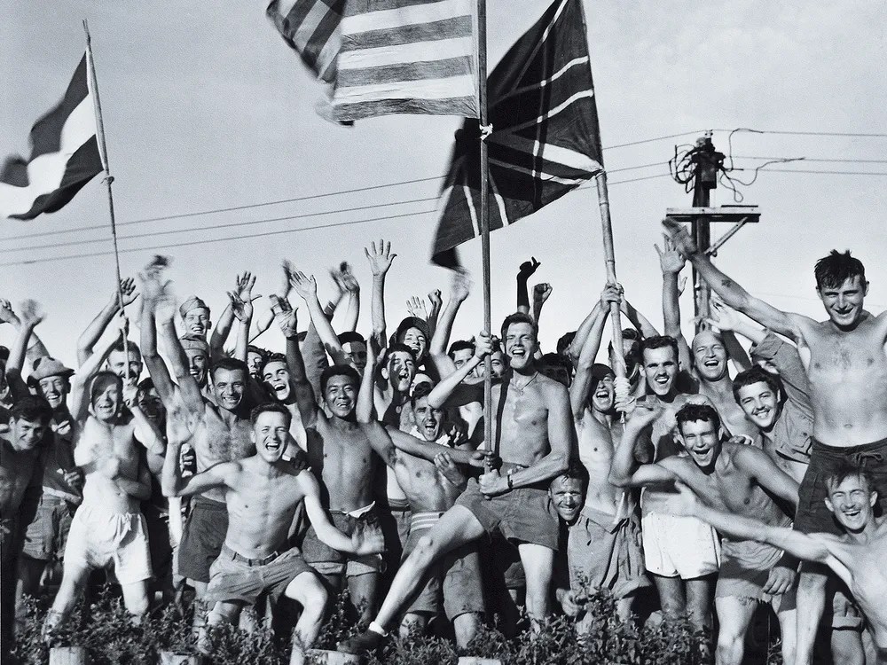 American and Allied prisoners celebrate their liberation from a Japanese prison camp near the city of Yokohama on August 29, 1945. Approximately 116,000 of the 130,000 Americans taken prisoner in World War II survived their captivity. (National Archives)