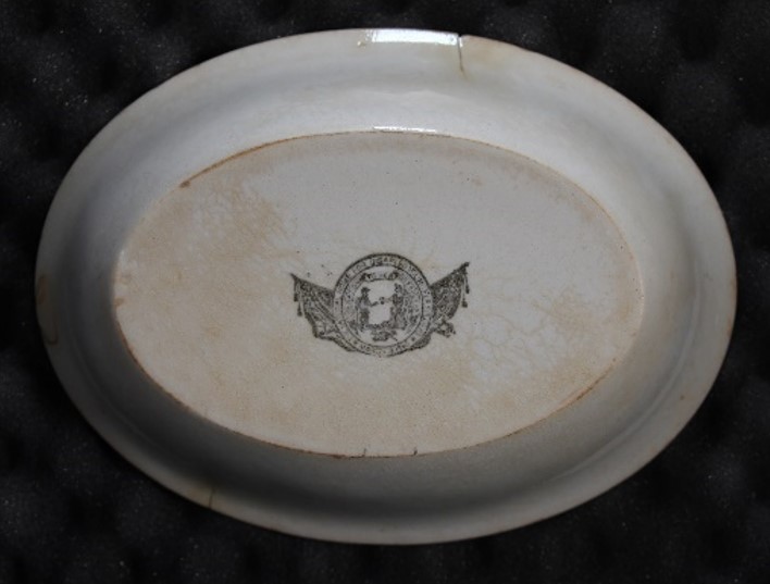 Seal on back of dish.