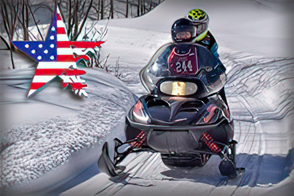 two veterans riding a snowmobile