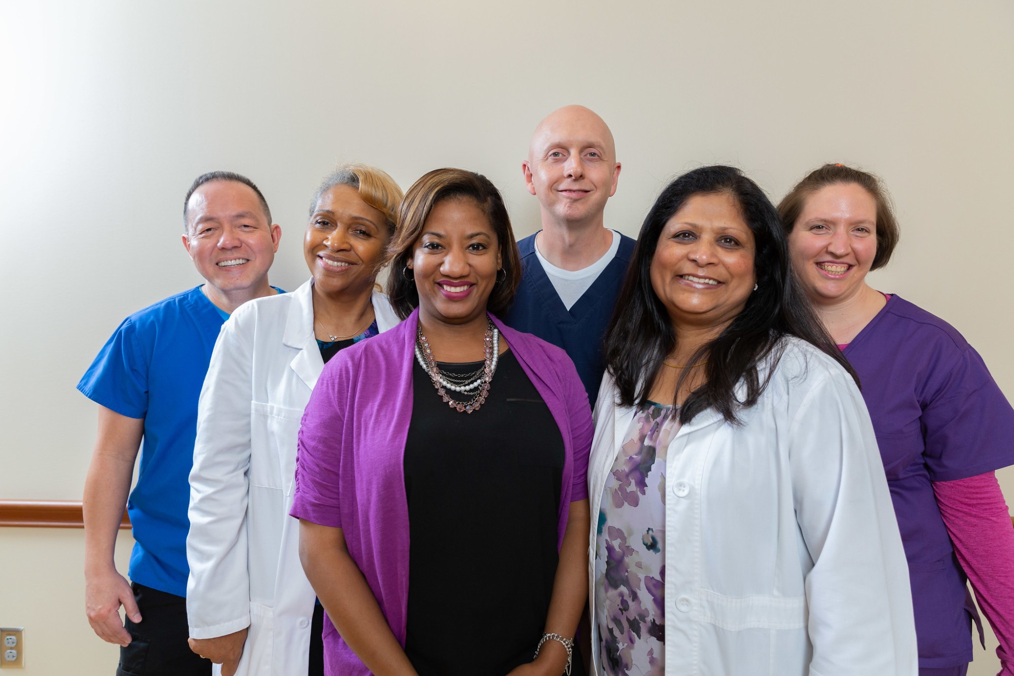 Member of the Houston VA Medical Center - four women and two men - pose for a photo.