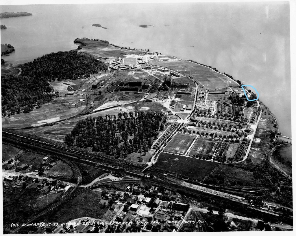 Aerial view of the Veterans’ Administration hospital complex looking south towards the Susquehanna River, 1936. The Grist Mill and Manor House are located in the circled area along the shoreline, center-right. (VA Collection)