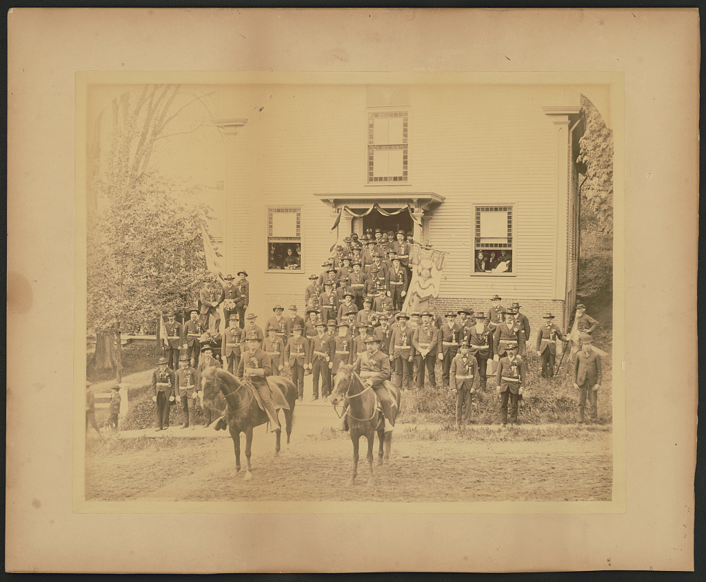 Members of G.A.R. post in New York pose in full uniform and regalia, c. 1880. (Library of Congress)