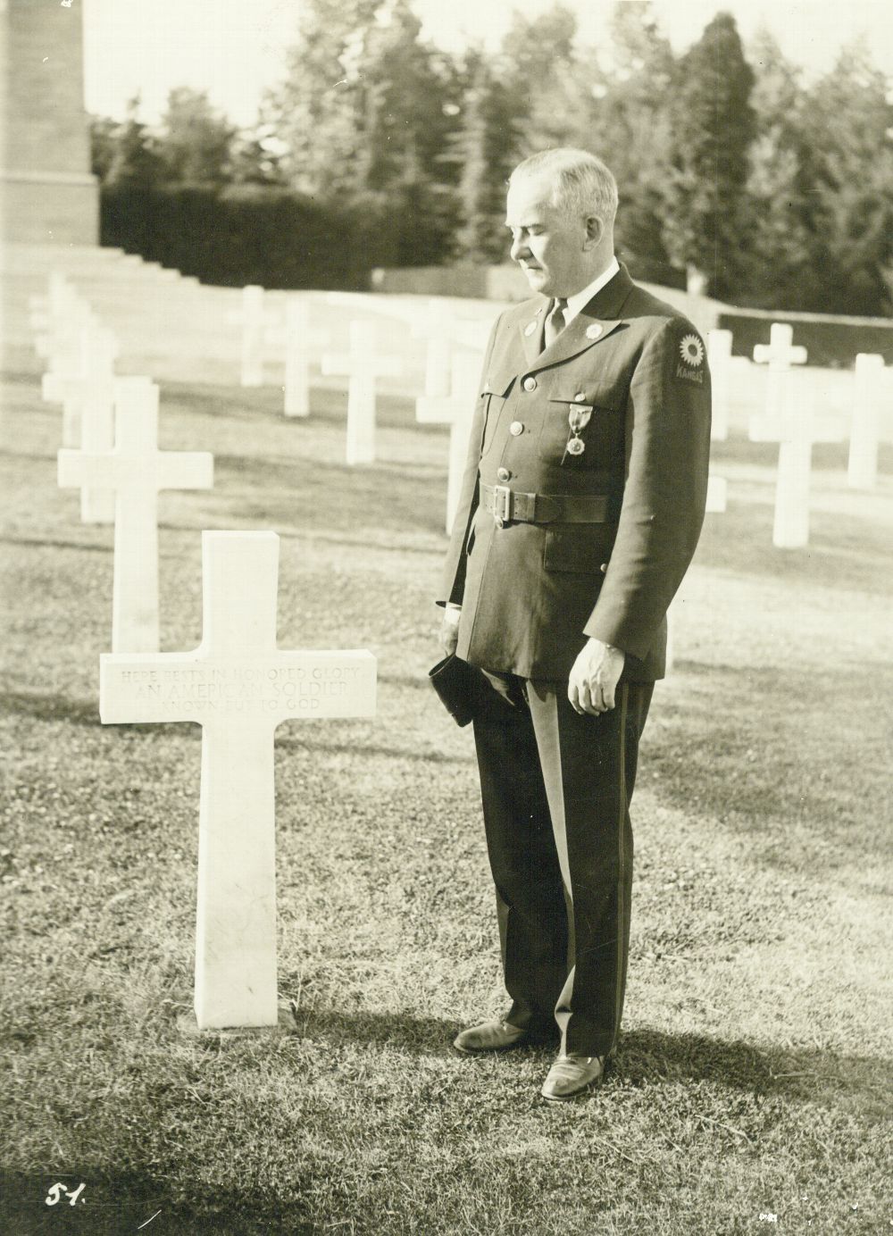 Harry Colmery during his time as National Commander of the American Legion in 1937, paying his respects to American dead at a World War I military cemetery in France. (Kansas Historical Society)