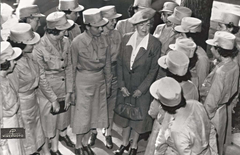 Edith Rogers surrounded by members of the Women’s Auxiliary Army Corps at the Fort Des Moines, Iowa, training center in 1942. She delivered the graduation address to the first class of officer candidates. Rogers stands in the middle of a group of approximately 16 other military uniformed women. (AP Wirephoto)