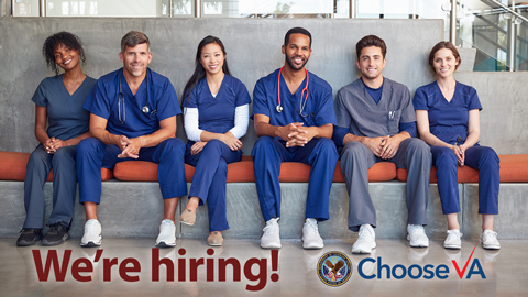 A group of nurses sitting on a bench.